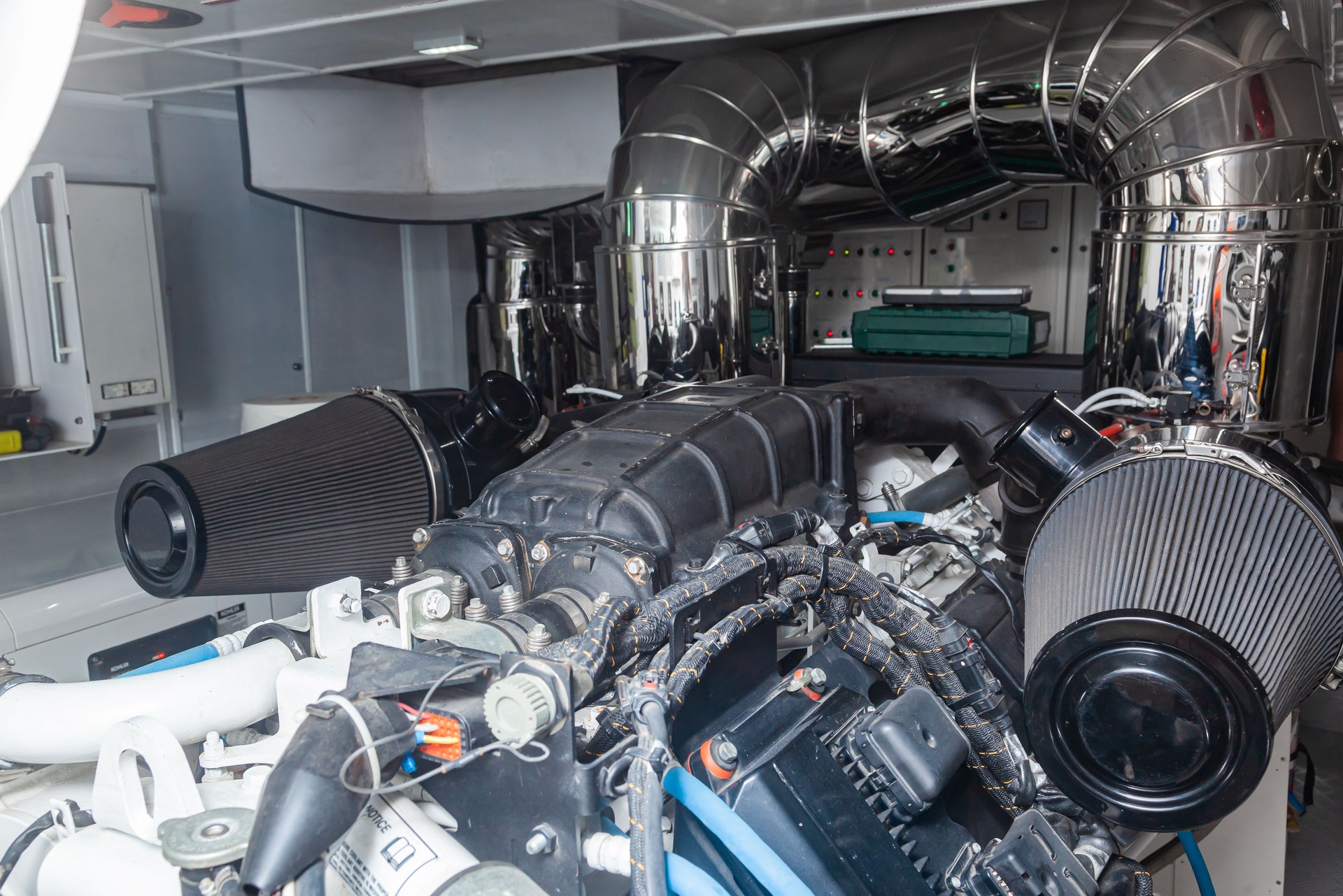 A new marine engine is installed inside a luxury yacht.